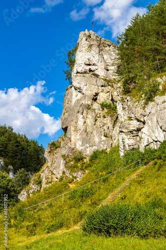 Grupa Zabiego Konia limestone rock massif with Zabi Kon rock in Kobylanska Valley within Jura Krakowsko-Czestochowska upland near Cracow in Lesser Poland photo