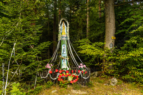 Holy Mary village shrine aside path to Potrojna peak from Targanice village on northern slope of Little Beskids in of Beskidy Mountains in Lesser Poland photo