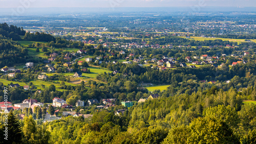 Fototapeta Naklejka Na Ścianę i Meble -  Panoramic view of northern slope of Little Beskids in of Beskidy Mountains with Targanice Village near Andrychow town in Lesser Poland