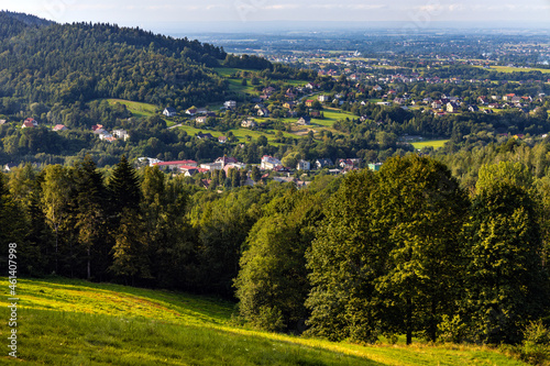 Fototapeta Naklejka Na Ścianę i Meble -  Panoramic view of northern slope of Little Beskids in of Beskidy Mountains with Targanice Village near Andrychow town in Lesser Poland