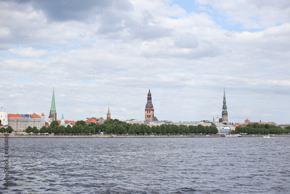 Cityscape view of old Riga architecture buildings and churches near river Daugava.