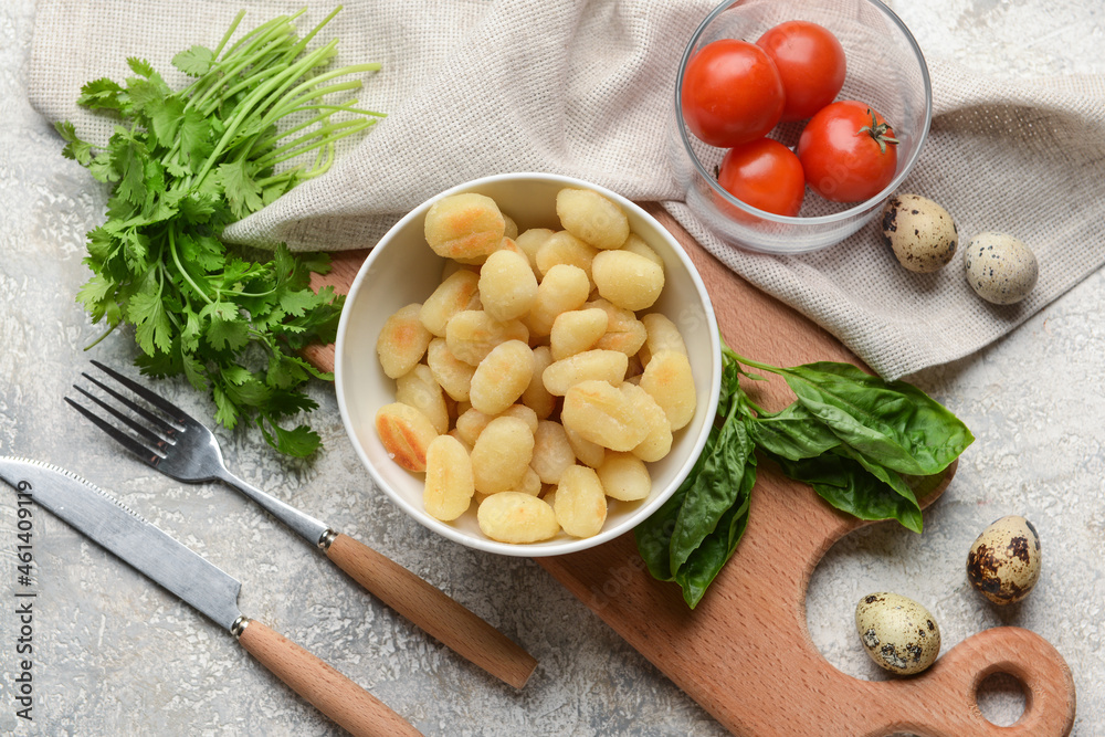 Composition with tasty gnocchi on light background