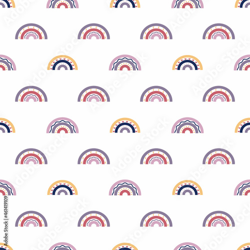 Seamless pattern with rainbows and circles. Cute multicolored vector illustration in ethnic style for kids. The print is suitable for printing on fabric, clothing, wrapping paper, bedding