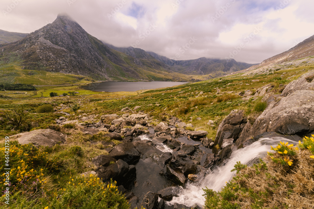 Tryfan Mountain Landscape with Ogwen Water and a waterfall leading down to Ogwen Water and the very distinctive and attractive Tryfan Mountain.