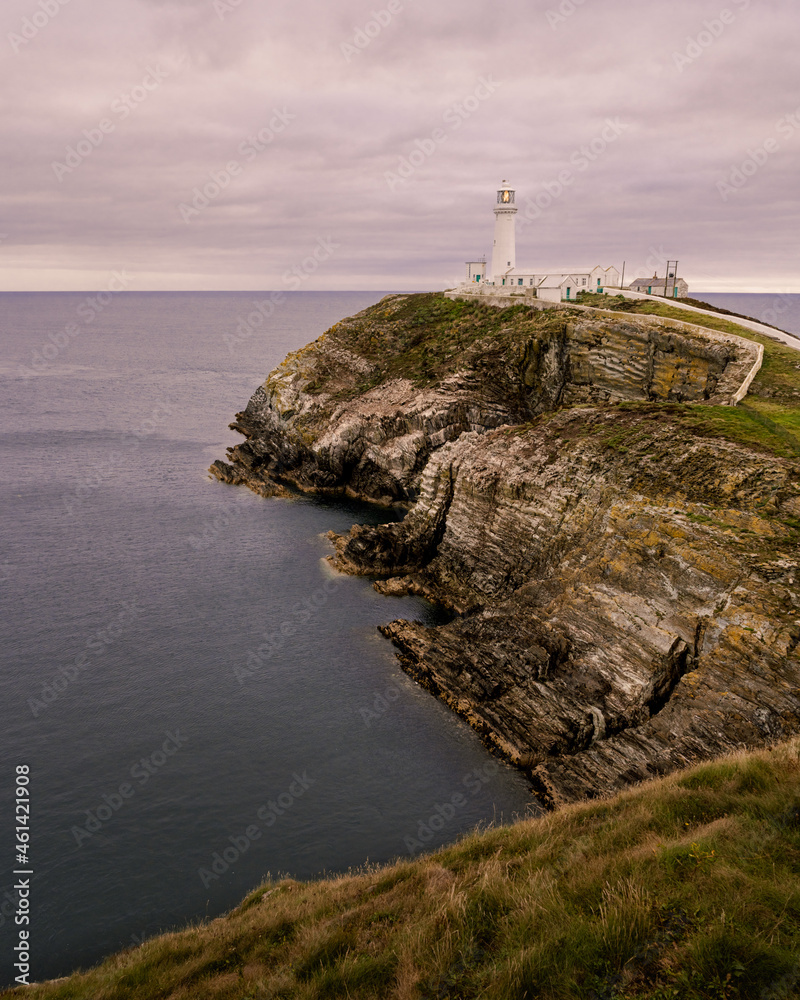 Sunset at South Stack Lighthouse with the path leading out in the the Irish Sea.  
