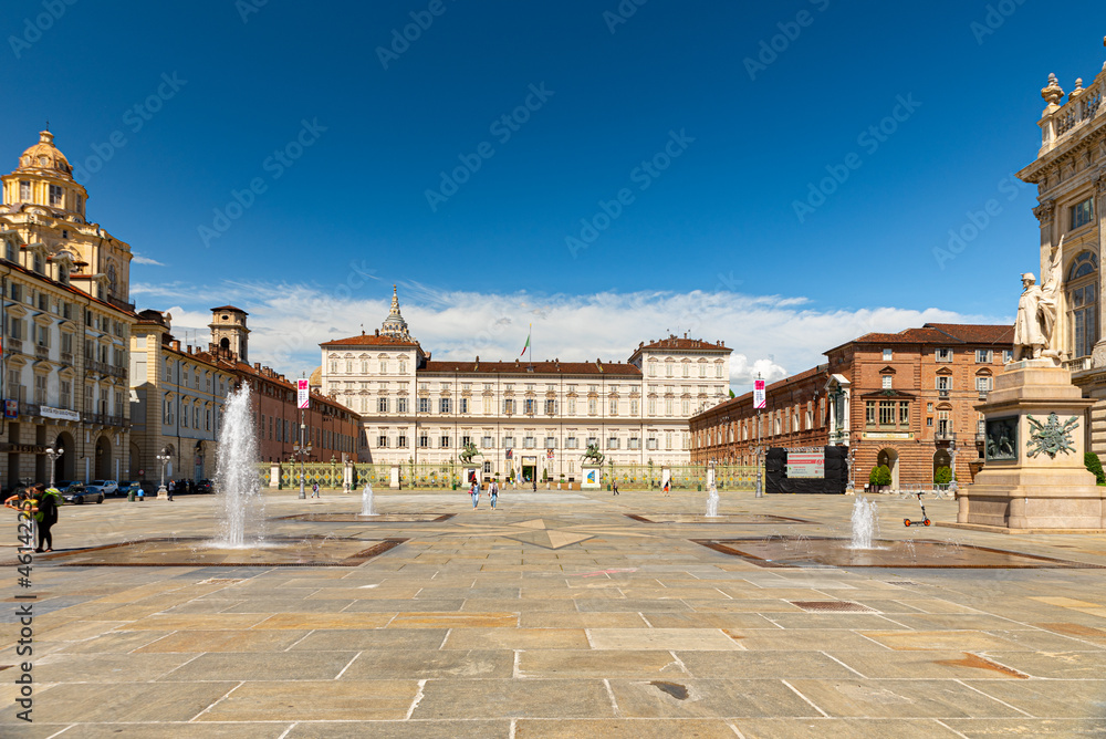 Turin, Italy. May 12th, 2021. View of the Royal Palace and Piazza Castello square in the historic center of the city with fountains and some people walking around.