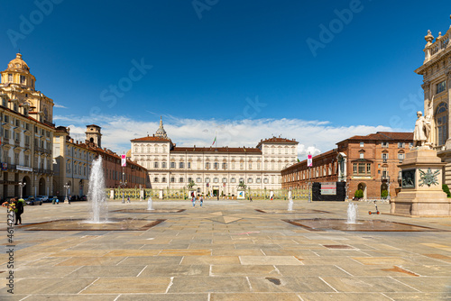 Turin, Italy. May 12th, 2021. View of the Royal Palace and Piazza Castello square in the historic center of the city with fountains and some people walking around.