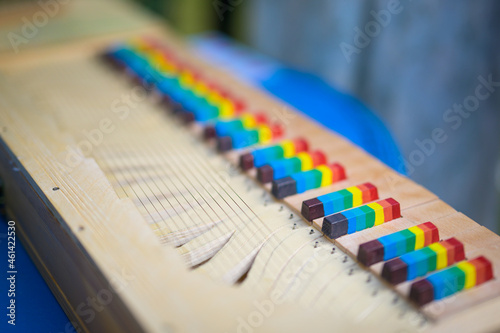 фотографія Closeup of a small clavichord with colorful keys