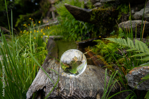 Glass ball lying on an old trough