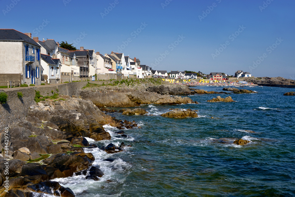 Rocky coast and beach of Saint Michel in the background at Batz-sur-Mer, a commune in the Loire-Atlantique department in western France. The town lies between the Bay of Biscay and its salt marshes.