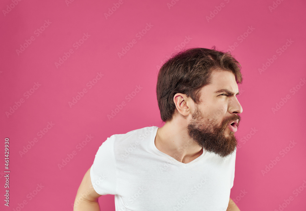 emotional man in a white t-shirt hand gestures Studio emotional man in a white t-shirt hand gestures Studio