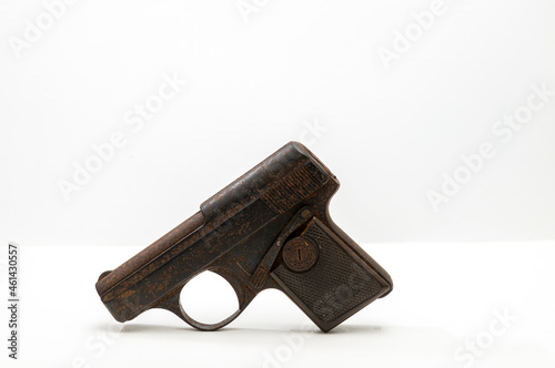 small world war two handgun or pistol on white background .