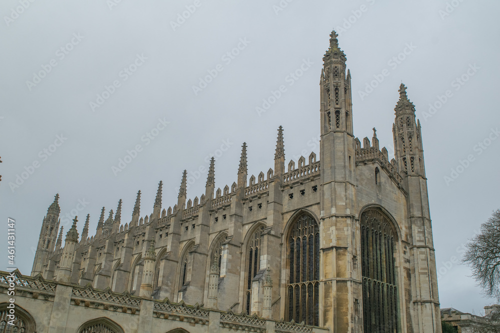 Facade of impressive Gothic style chapel with ornate stained glass windows in Cambridge England