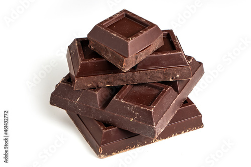 Broken pieces of dark chocolate close up