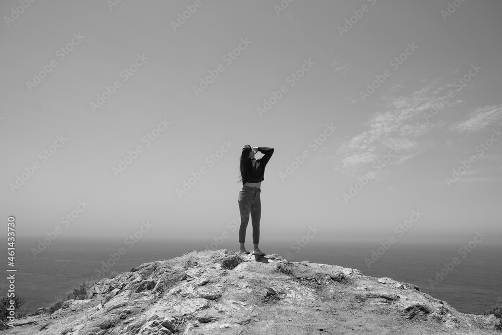 Obraz premium silhouette of a person on a rock