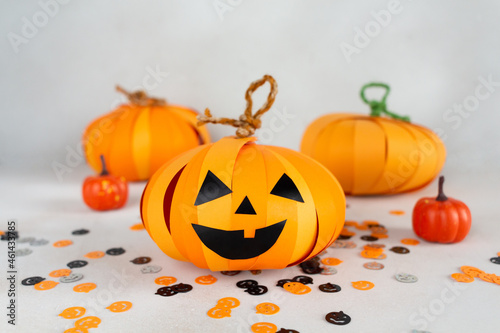 How to make Halloween pumpkin Jack from color paper with children. Step by step tutorial. Handmade DIY holiday decoration project. Step 16, final.