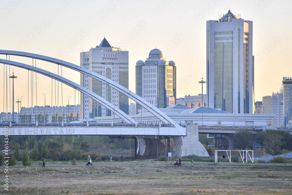 Naklejka premium astana city, nur sultan city, building, skyline, architecture, skyscraper, river, bridge, urban, water, business, sky, cityscape, tower, buildings, office, kazakhstan, downtown, travel, park, florida,