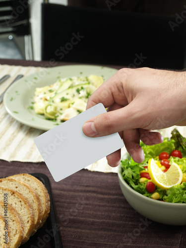 Paying with card after eating.