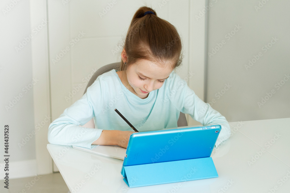 Young girl-teenager sit at desk working at home. Concept study from home and social distancing from covid-19 crisis. Young girl-teenager sit at desk working at home. Concept study from home and social distancing from covid-19 crisis.