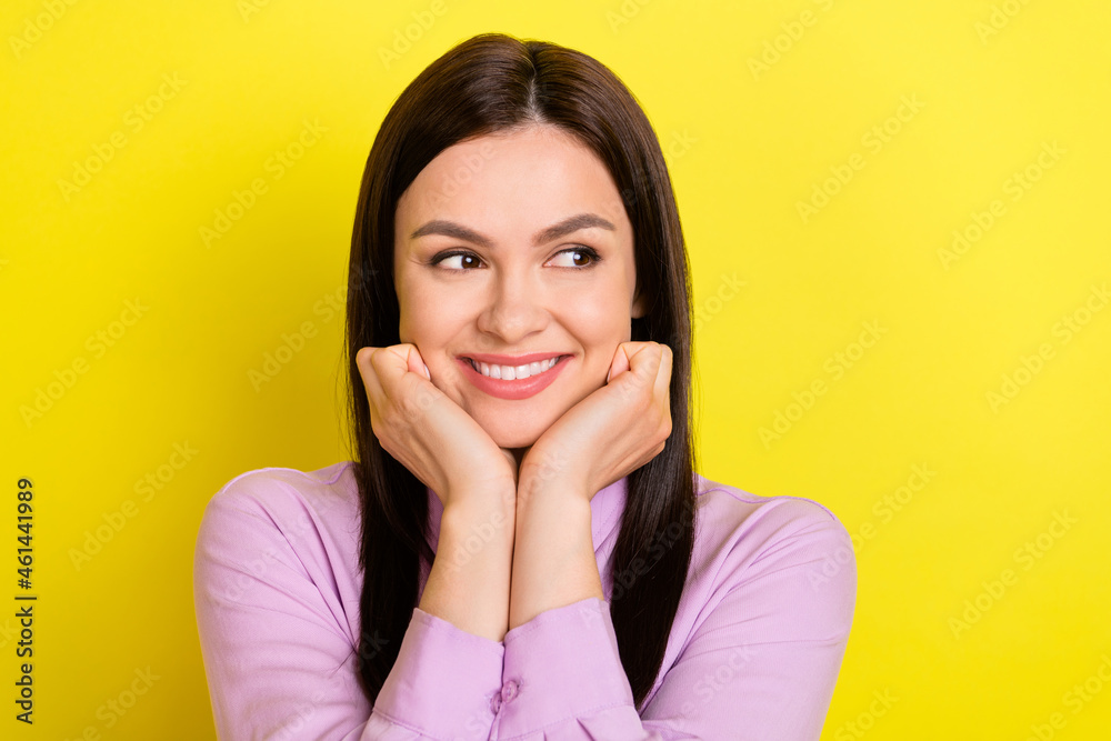 Portrait of attractive cheerful curious girl looking aside fantasizing isolated over bright yellow color background Portrait of attractive cheerful curious girl looking aside fantasizing isolated over bright yellow color background