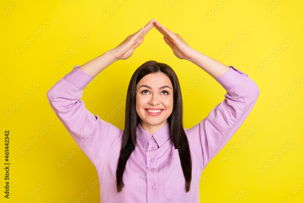 Photo of funny brown hairdo agent lady hold look arms up wear purple shirt isolated on yellow color background