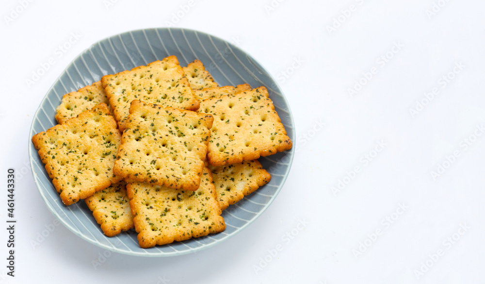 Seaweed crackers in plate on white background.