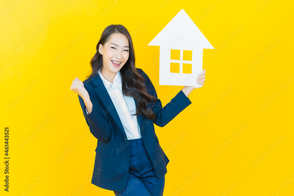 Portrait beautiful young asian woman with house or home paper sign Portrait beautiful young asian woman with house or home paper sign