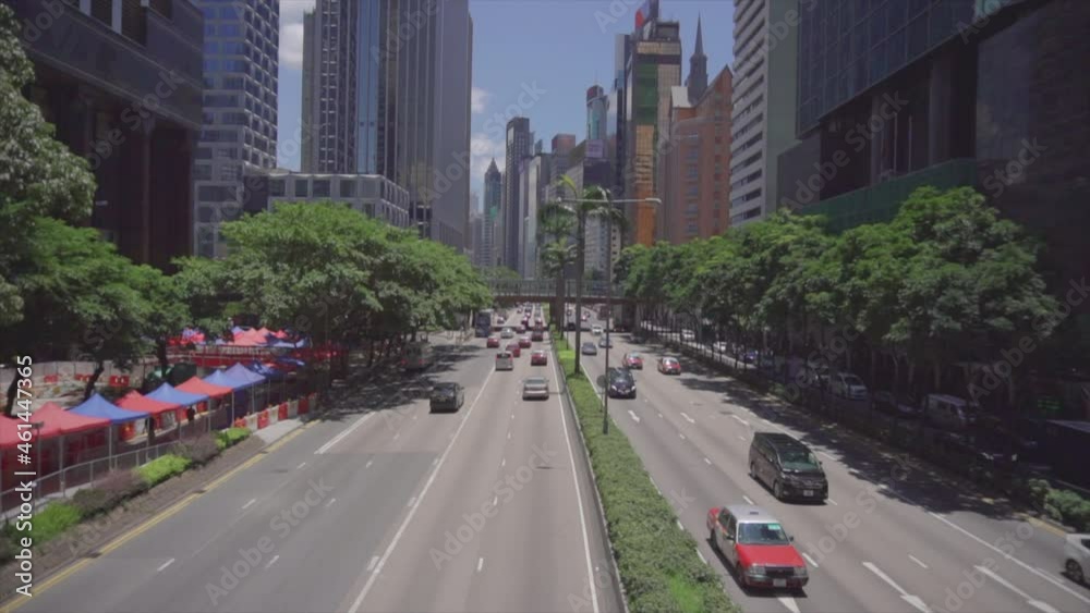 Establishing shot of Asian city with traffic going both ways from high angle Establishing shot of Asian city with traffic going both ways from high angle