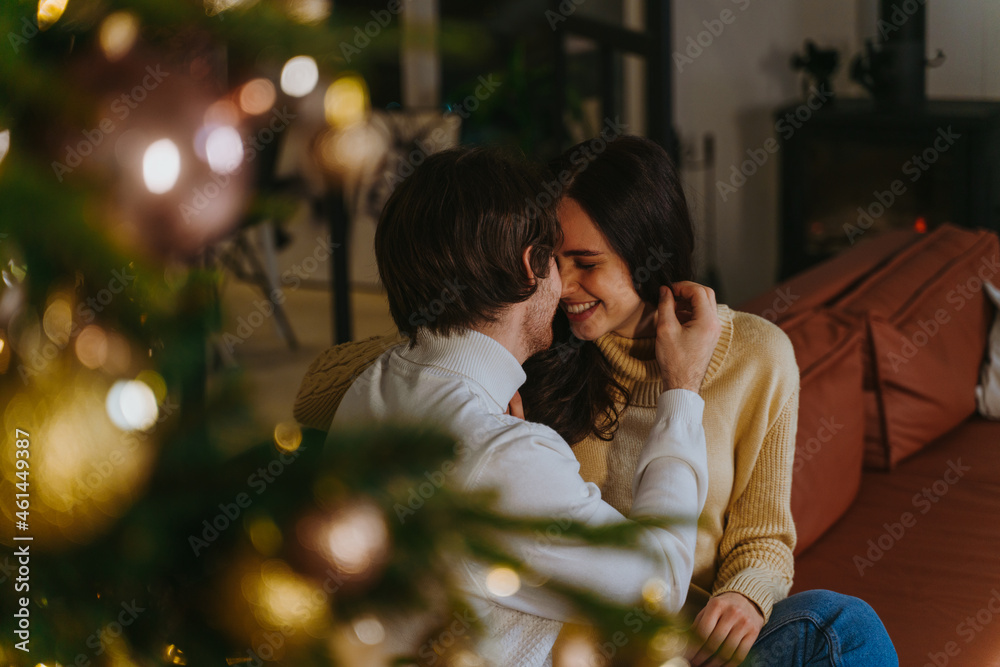Cinematic image of a couple celebrating christmas at home. Cinematic image of a couple celebrating christmas at home.