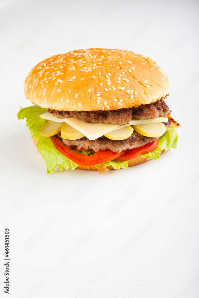 hamburger with two cutlets and cucumbers with tomatoes hamburger with two cutlets and cucumbers with tomatoes