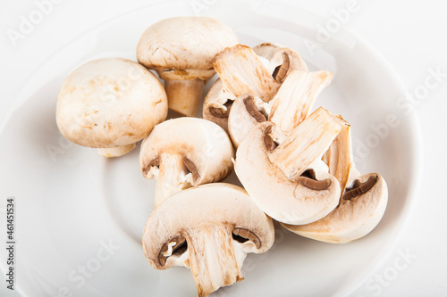 chopped champignons on a white plate to add to pizza