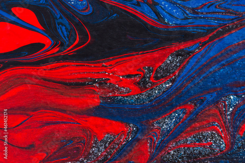 Red, black, blue acrylic fluid art, abstract creative Christmas background. Artistic bright futuristic background. Dynamic lines, water movement, splash. Design of holiday cards. Marble trendy texture