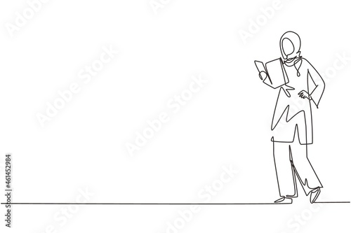 Single one line drawing happy modern young Arabian woman reading book standing. Smiling Arab female reader enjoying literature or preparing for exam continuous line draw design vector illustration