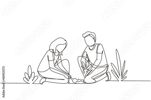 Single one line drawing young man woman are planting tree. Gardening, garden tools, spring, stalk. Couple plants seedling. Girl helps man plant young tree. Continuous line draw design graphic vector