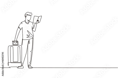 Single one line drawing man reading textbook. Male student standing with open book in hands and suitcase. Enthusiastic reader for educational and hobby. Continuous line draw design vector illustration