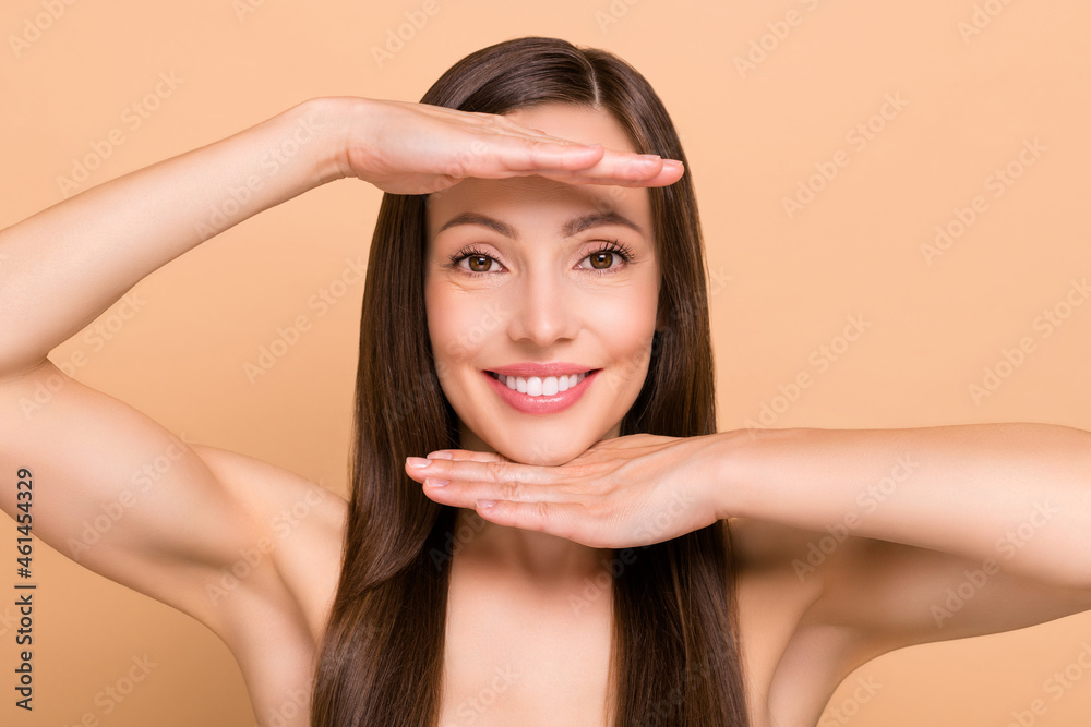 Photo of cheerful charming young lady wear nothing nude smiling arms face isolated beige color background Photo of cheerful charming young lady wear nothing nude smiling arms face isolated beige color background
