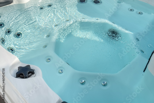 Luxury bathtub, jacuzzi for therapeutic massage and relaxation close-up.