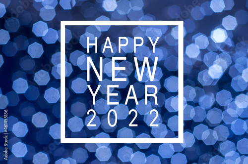 Christmas holiday festive glittering defocused blue background with bokeh lights - Happy new year 2022