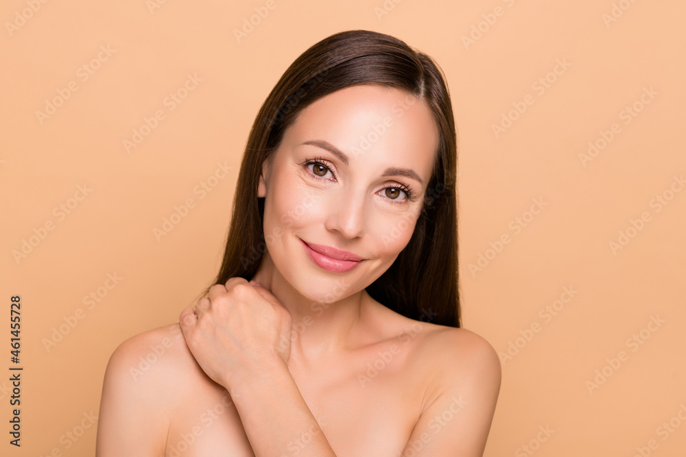 Portrait of attractive healthy cheery woman washing cleansing shower gel soap isolated over beige pastel color background Portrait of attractive healthy cheery woman washing cleansing shower gel soap isolated over beige pastel color background