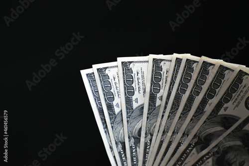 Cuadro en lienzo Money in hand, close-up one thousand dollars on black background, cash