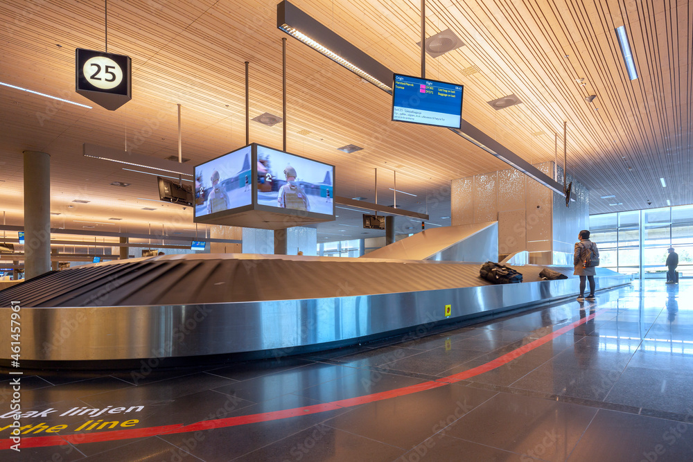 Wheeled suitcase on a luggage belt at the airport terminal. Wheeled suitcase on a luggage belt at the airport terminal.