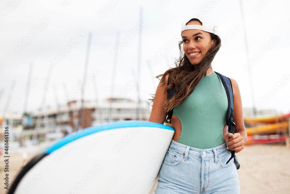 Beautiful woman with surfboard. Hot beautful girl preparing for the surf..