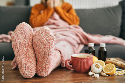 Woman with warm socks having a heavy flu photo