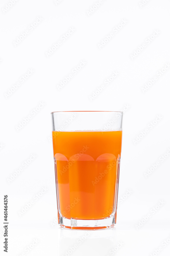 Pumpkin juice in transparent glass isolated on white background. Vegetable vegetarian drink. Healthy food and diet. Pumpkin juice in transparent glass isolated on white background. Vegetable vegetarian drink. Healthy food and diet.