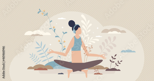 Guided meditation and yoga activity using headphones tiny person concept. Distant listening and relaxation from home as mental or emotional therapy for mind wellness and calm body vector illustration. photo