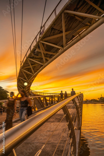 the S -shaped bridge at dusk which is the bridge of pride of the state of sarawak and tourism
