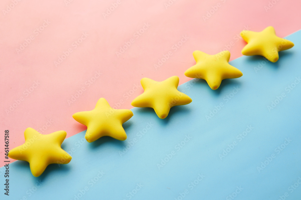 Customer review concept. Rating golden stars on blue background Customer review concept. Rating golden stars on blue background