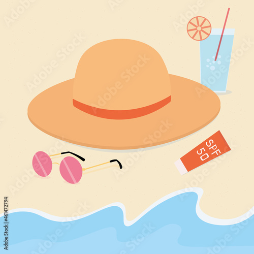 The concept of a vacation trip to the sea or ocean. Beach holidays. On the sandy shore, washed by the waves, lies a straw hat, round sunglasses with pink lenses, sunscreen and a refreshing cocktail