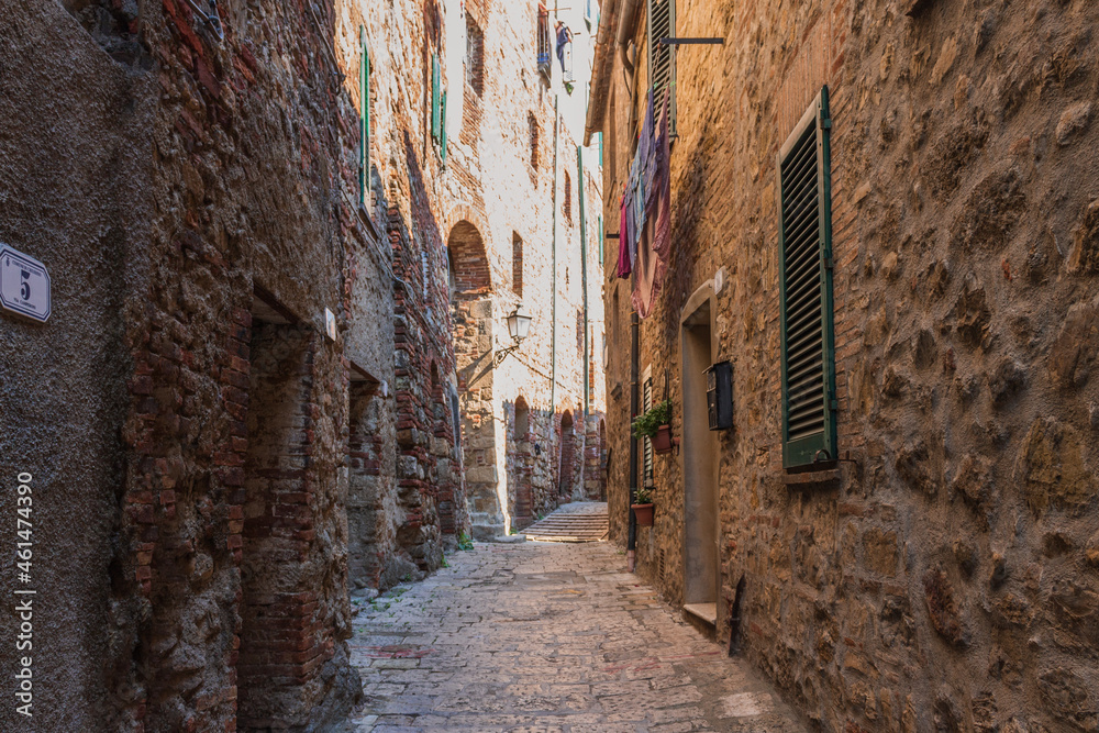View of narrow street in Chiusdino, Tuscany, Italy. Copy space.