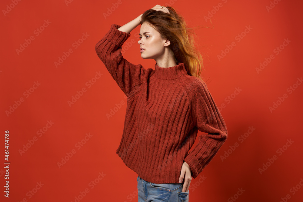 woman in a red sweater beautiful hairstyle fashion lifestyle close-up woman in a red sweater beautiful hairstyle fashion lifestyle close-up